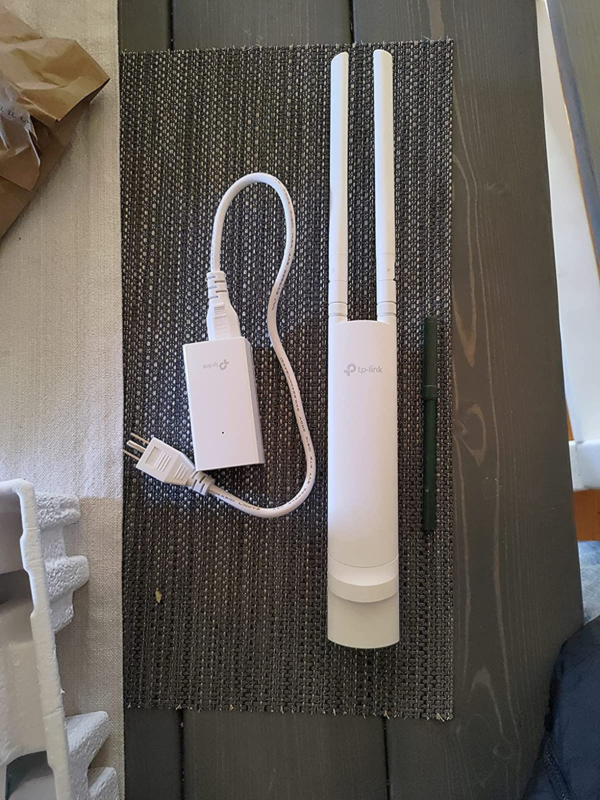 a reviewer photograph  of the wi-fi extender 