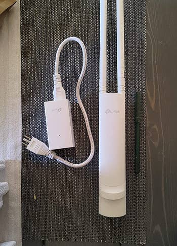 a reviewer photo of the wi-fi extender 