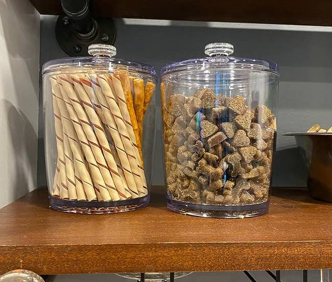 two acrylic canisters holding dog treats