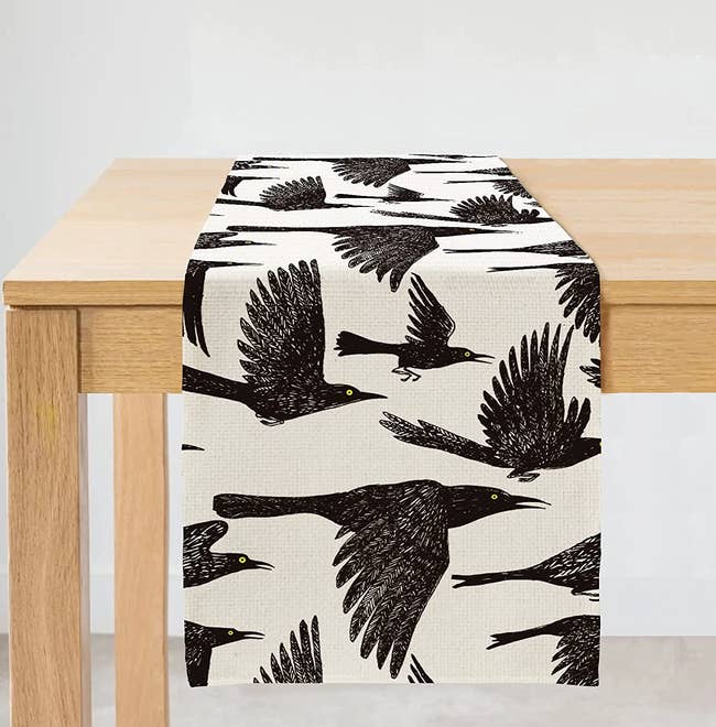 table runner with illustrated crow pattern 