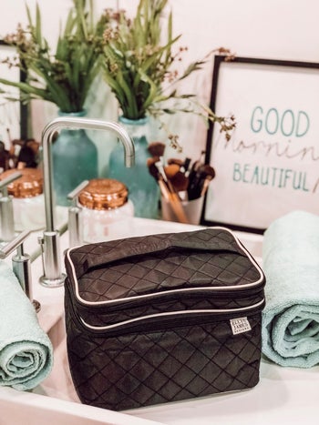 reviewer photo of blck quilted makeup bag