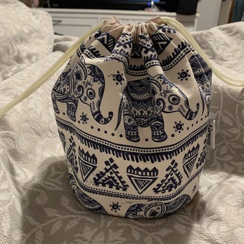 a reviewer photo of the drawstring travel bag closed up