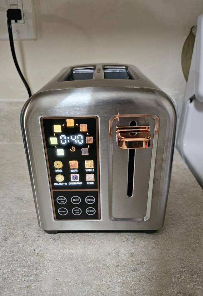 A modern toaster with digital controls and a variety of settings for different types of bread, shown on a kitchen counter