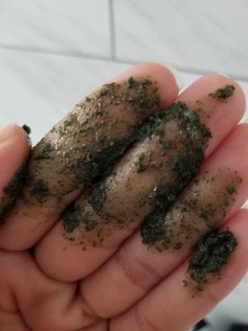 another reviewer showing texture of the green, gritty scrub in their hand 