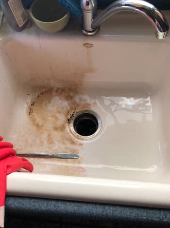 a reviewer's sink half brown and half clean and white