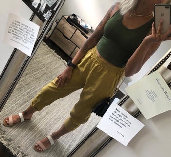 reviewer mirror selfie wearing green tapered trousers