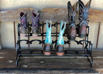 cowboy boots in horseshoe boot rack