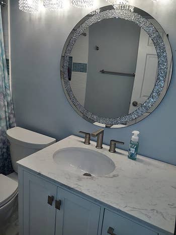 A reviewer's bathroom with the mirror hung right above their sink