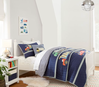 white kids' twin bed frame in kid's bedroom