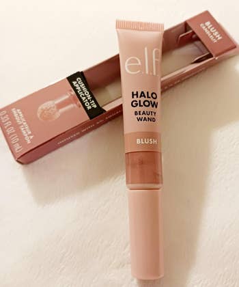 e.l.f. Halo Glow Beauty Wand Blush with cushion extremity   applicator, packaged and acceptable   for shopping