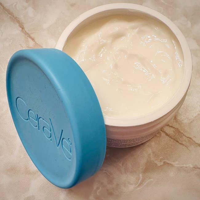 reviewer image of the open container of body cream