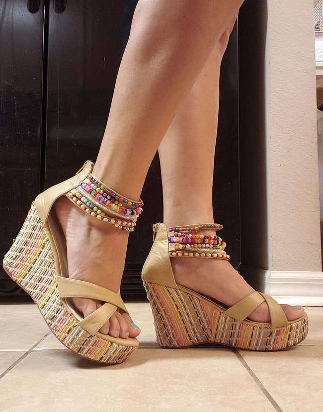 a reviewer wearing the wedge sandals 