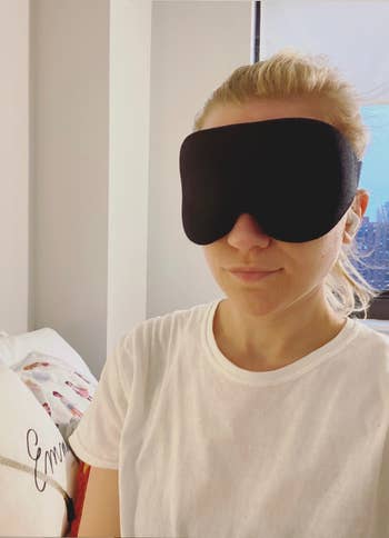 BuzzFeed editor wearing black eye mask 