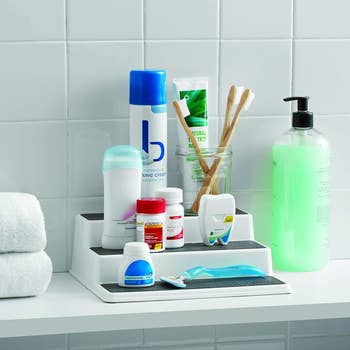 bathroom products on the three-tier shelf