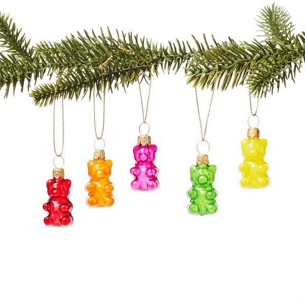 five gummy bear ornaments in red, green, orange, pink, and yellow