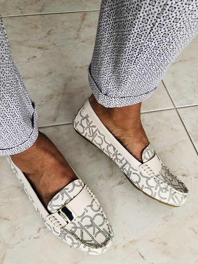 Close up of reviewer wearing the loafer in white