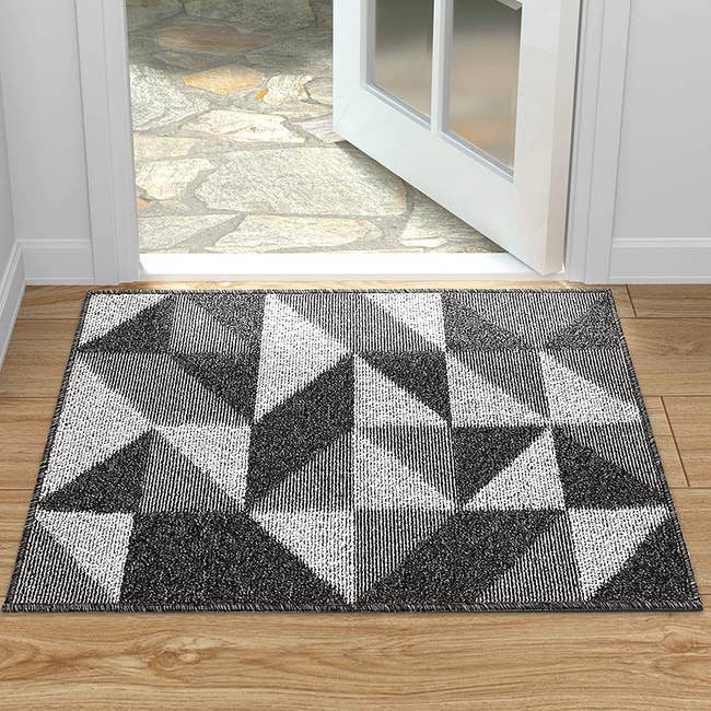 mat inside door with gray geometric pattern