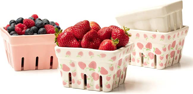 the set of four berry baskets holding strawberries, blueberries, and raspberries 