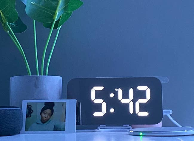 reviewer image of the digital alarm clock on a bedside table