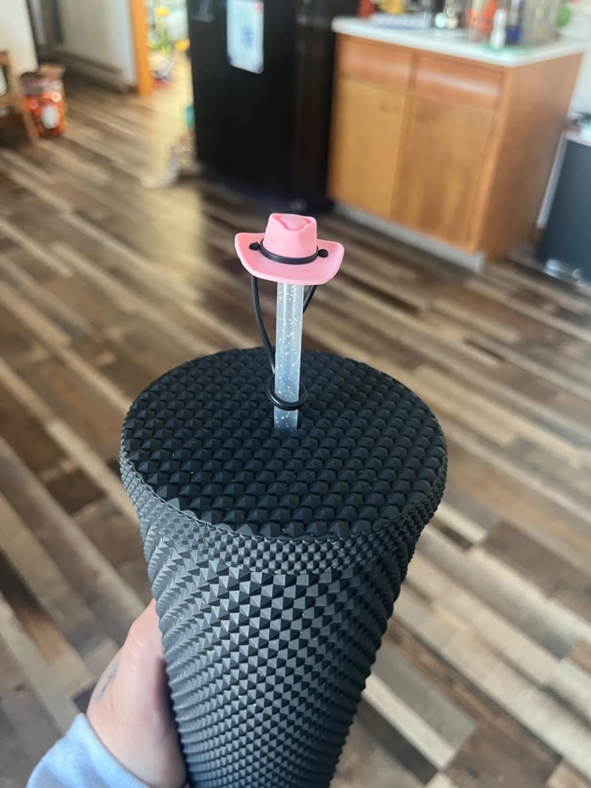 pink cowboy chapeau  connected  a straw