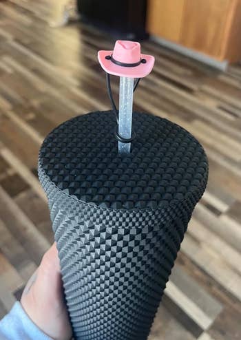 pink cowboy chapeau connected a straw