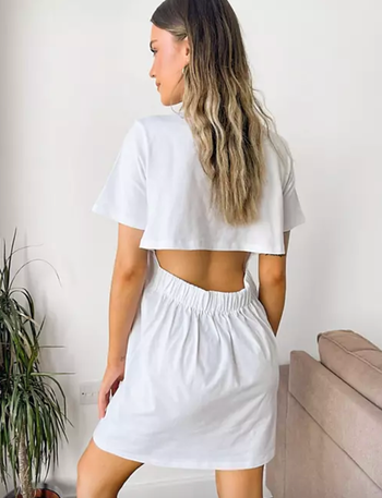 model showing the back of the white dress