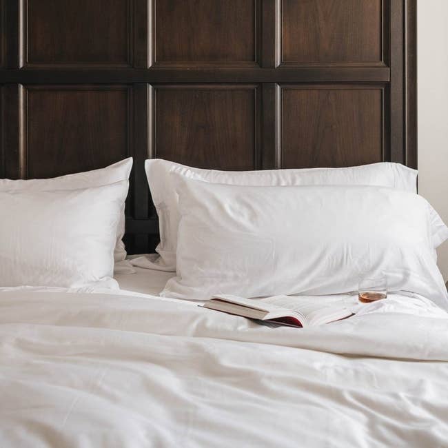 two white pillowcases on a bed