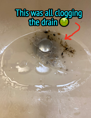 Reviewer's drain with a bunch of water and dirt 