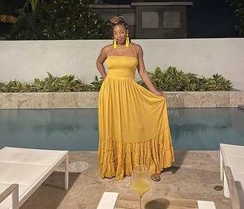 reviewer wearing the mustard colored dress