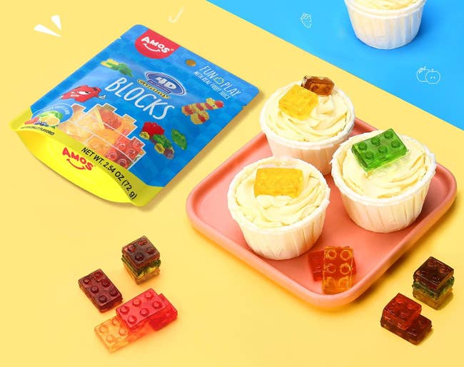 gummy lego-shaped blocks in a bag and decorating cupcakes 