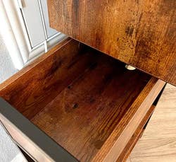 same table with top compartment open to reveal storage inside