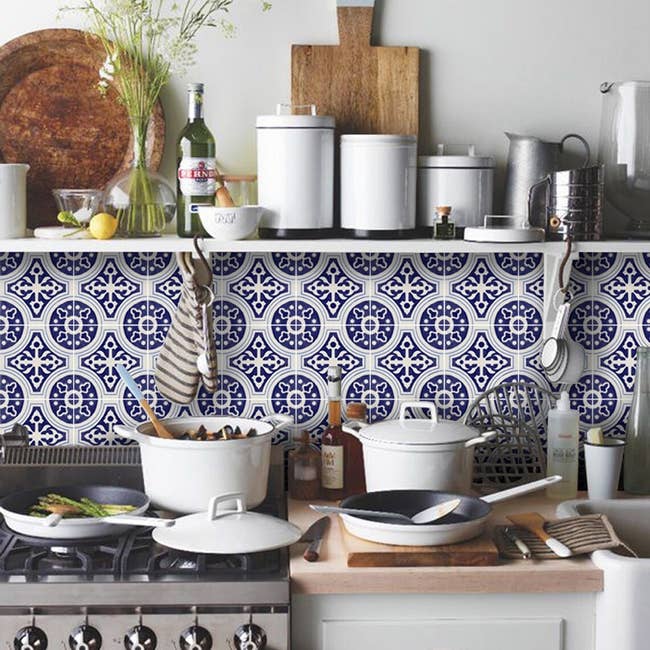 the bluish and achromatic backsplash utilizing the decals