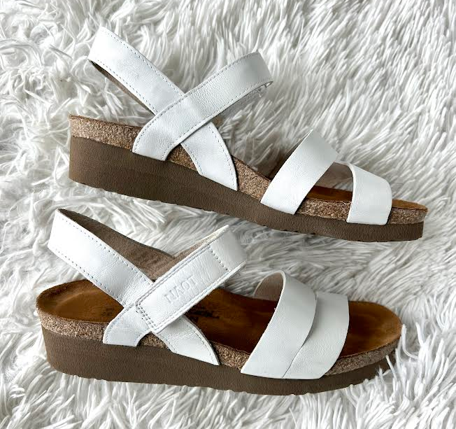 BuzzFeed writer's image of white and brown wedge sandals