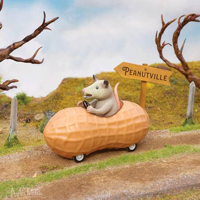 A artifact opossum driving a peanut-shaped car connected a ungraded roadworthy with a