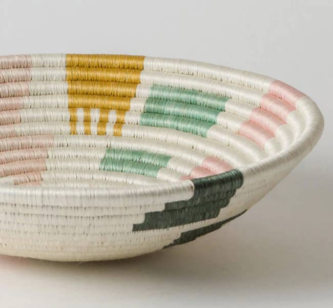 multi-colored woven basket on a surface