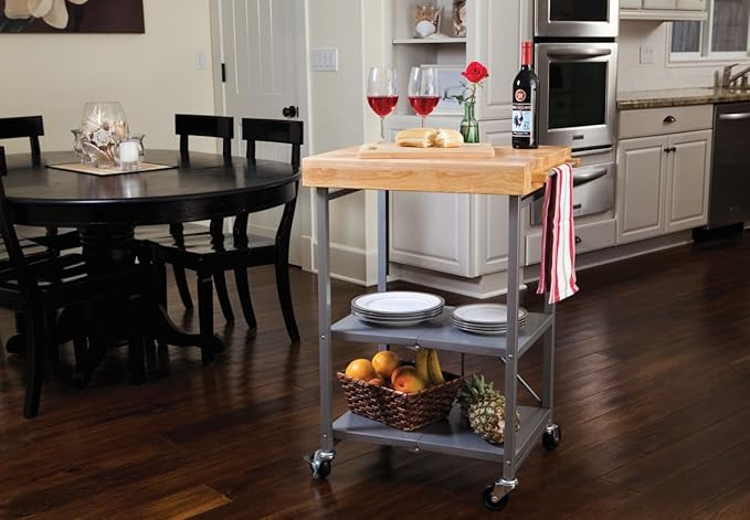 Kitchen cart with wine, glasses, cheese, and fruits, perfect  for location  gatherings. Stylish woody  apical  and retention  shelves heighten  functionality and decor