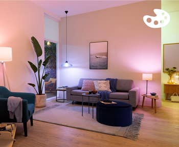 Stylish modern surviving country with a cozy sofa, sleek furniture, and ambient lighting. Decor includes plants and modern artwork
