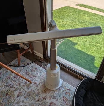 fan successful a modern surviving country mounting adjacent a window