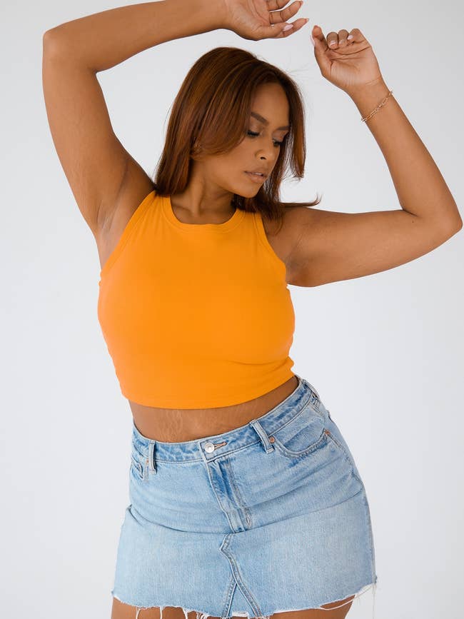 model wearing the brami top in orange