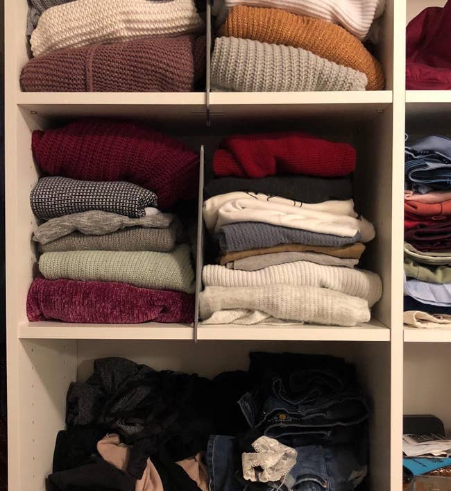 the two shelf dividers used to organize stacks of sweaters