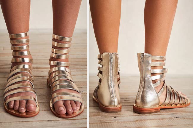 Model wearing platinum colored gladiator sandals with straps past the ankle, back view of model wearing product with a high zipper back