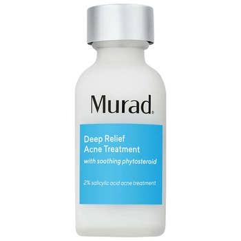 the bottle of acne treatment serum