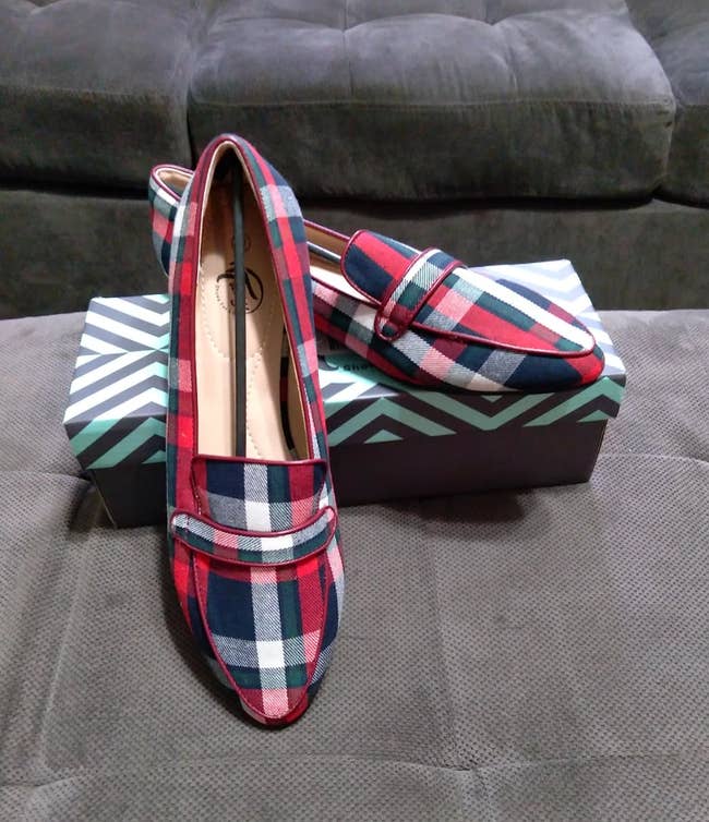 Close up of reviewer's posed shoes showcasing the red and blue plaid design