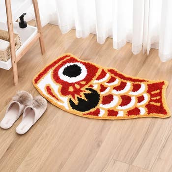 Image of the red koi fish rug in the bathroom