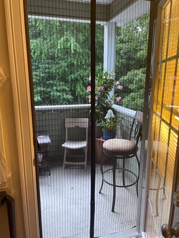 another reviewer photo showing the magnetic screen door out to balcony