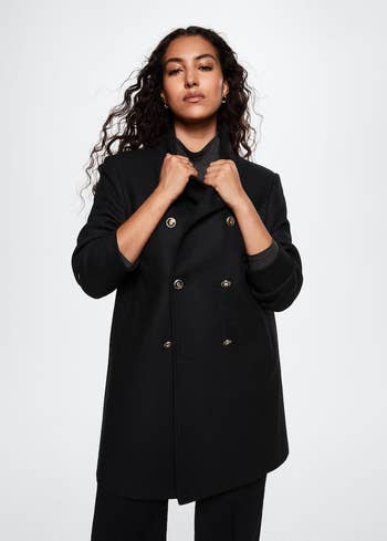 Different model wearing coat buttoned up