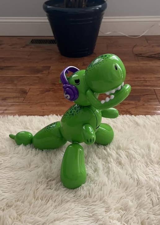 reviewer's green balloon dinosaur