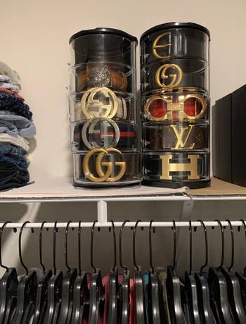 two of the belt organizers on top of a closet shelf