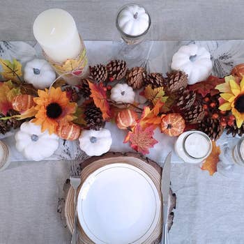 an autumn table scape with the white pumpkins mixed in