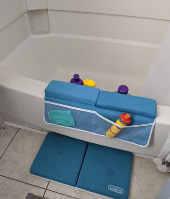 reviewer image of blue knee and elbow rest for bath in blue